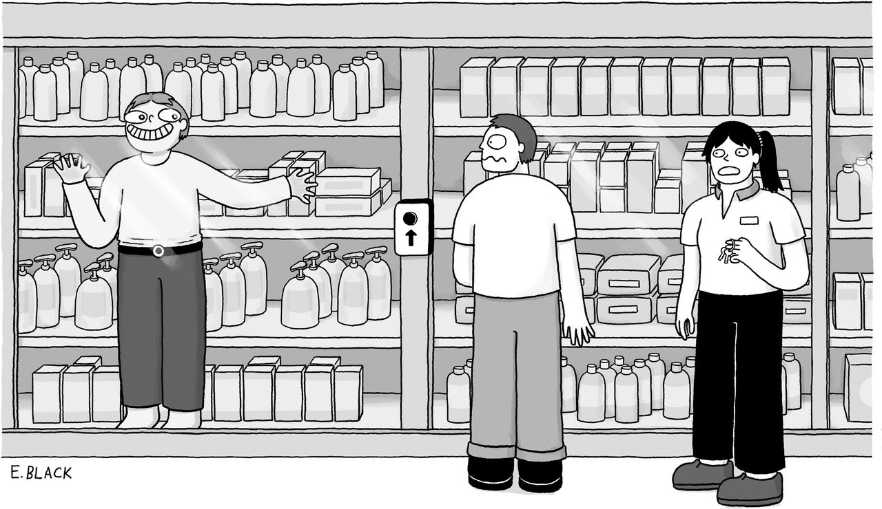 Man leering inside glass display cabinet that employee is unlocking for customer.